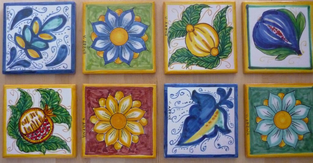 Handpainted tiles with bright yellows, blues, reds and greens.