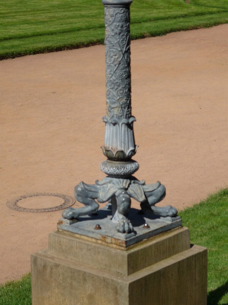 lamp post with four feet and very knobby knees outside the Zwinger Museum in Dresden.