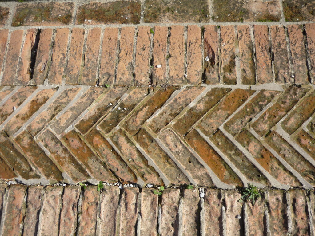 1000-year-old brick paving in a herringbone pattern.