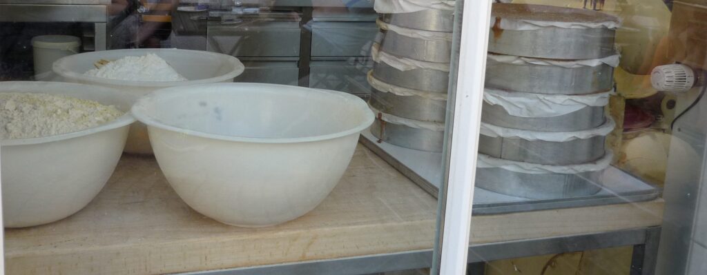 baking dishes in the window of a fancy bakery kitchen