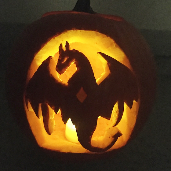 carved pumpkin with dragon design