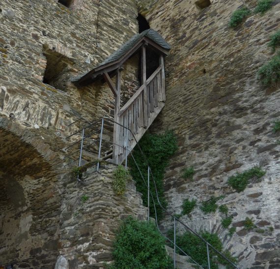 ancient ruin with rickety covered stairs