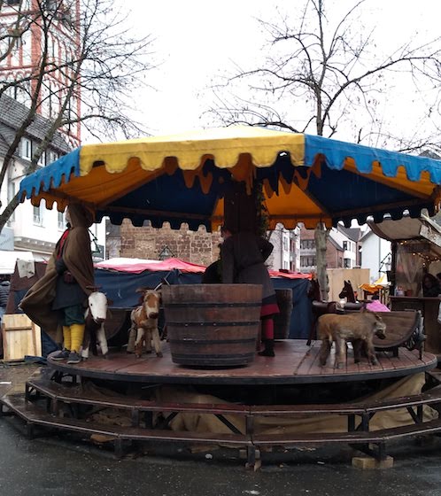 people powered wooden carousel