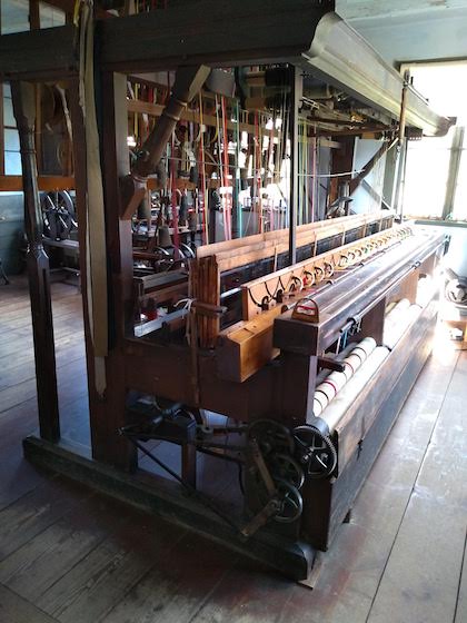 loom retrofitted with electric motor to weave ribbon