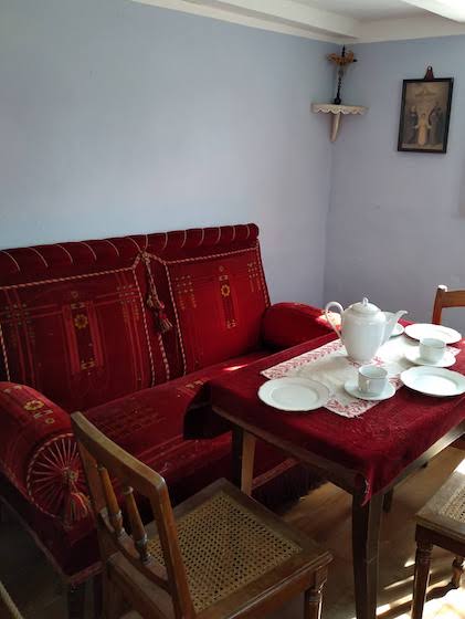 red sofa and table set for tea party