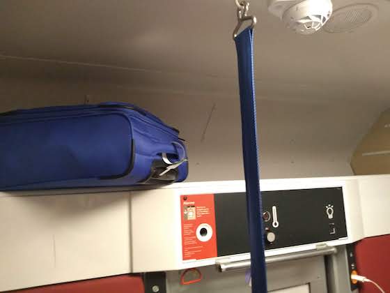 luggage loft inside private sleeper cabin on French night train