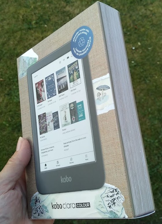 shiny new kobo ereader with a box that looks like a book