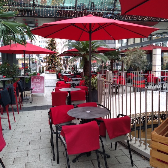 Outside tables with xmas tree in Eis Fontanella ice cream shop, Mannheim, Germany