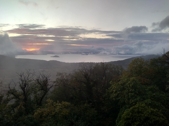 Mist and pink make the caldera of Lake Bolsena look like it's heating up.